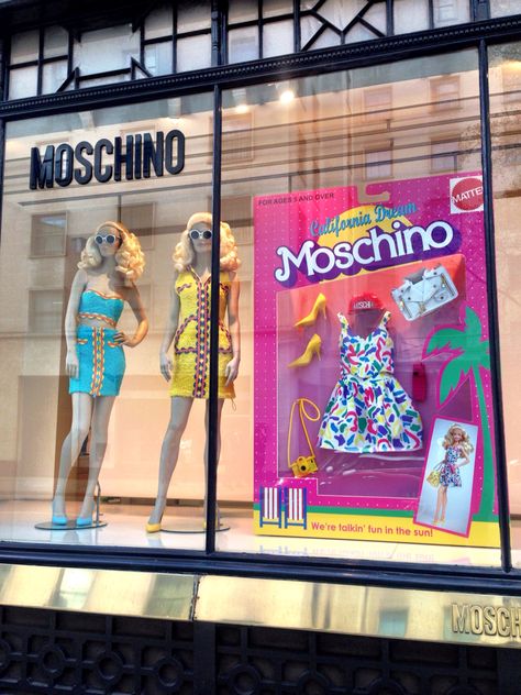 ￼Moschino does a great job of “Reach” to the customer. What moschino does that is different from other brand windows are they create a connection through childhood. The window display has a gian doll box, which connects to their target consumers-the female. Using the two mannequins with blonde hair standing next to a doll box reminds many people of their childhood "barbie" Barbie Store Display, Moschino Window Display, Barbie Window Display, Moschino Barbie, Barbie Display, Barbie Store, Fashion Window Display, Barbie Theme Party, Decoration Vitrine