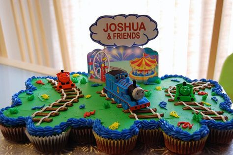 Thomas Cupcake Cake | Thomas cupcake cake | Flickr - Photo Sharing! Thomas The Train Birthday Cupcakes, Thomas The Train Cupcakes, Thomas The Train Pull Apart Cupcakes, Thomas The Train Cupcake Cake, Thomas Train Birthday Cupcake, Train Pull Apart Cupcake Cake, Train Cupcake Cake, Thomas Cupcakes, Heath Cake