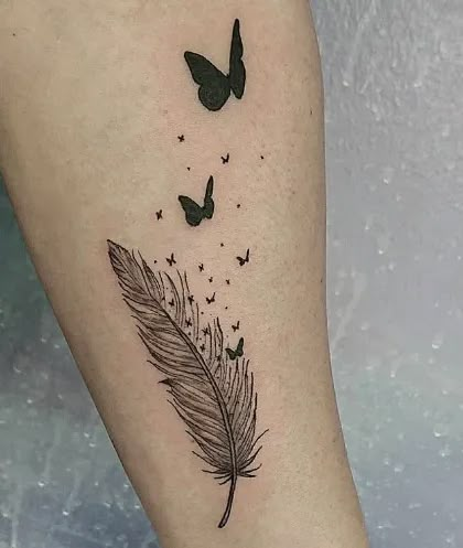 Looking for feather tattoo ideas? Click to learn about meaning, history and best placement of these freedom tattoos that can come in all shapes and sizes! #tattoostylist #feathertattoos #tattooideas #tattooforwoman #smalltattoos #tattoodesign Feather Tattoo With Butterflies, Feather Into Butterflies Tattoo, Butterfly And Feather Tattoo Ideas, Feather With Butterflies Tattoo, Butterfly Feather Tattoo, Freedom Tattoos For Women, Feather And Butterfly Tattoo, Feather Butterfly Tattoo, Tattoo Ideas Freedom