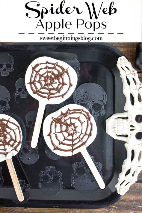 Spider Web Apple Pops are a fun and healthier Halloween Treat option with slices of Granny Smith apples dipped in white and dark chocolate with chocolate spider webs on top. #SweetBeginningsBlog #spiderweb #applepops #HalloweenTreatsWeek #dessert #Halloween Kitty Litter Cake, Apple Pops, Pinata Cookies, Chocolate Spiders, Dessert Halloween, Apple Pop, Halloween Party Treats, Healthy Halloween Treats, Chocolate Pops