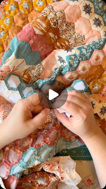 Zoe Mayson on Instagram: "Sewing away again, countless hours already in this quilt, but slow and relaxing hours that are good for the mind and soul!   Pattern - Hexagon Trip Around the World by me (comment trip if y ok want the pattern link ❤️)   Fabrics all by @artgalleryfabrics   #hexagontriparoundtheworld #hexagontriparoundtheworldquilt #epp #eppeverywhere #englishpaperpiecing #englishpaperpiecingeverywhere #handsewing #handsewn #patchwork #quiltyfun #quiltersofinstagram #slowstitching #slowstitchalong #slowstitchingmovement #creativelifehappylife #makersgonnamake #sewersgonnasew #scrappymakesmehappy #getcreative #slowcraft #makingformindfulness #theartofslow #theartofslowliving #handpiecing #papertemplates #hexielove #quiltlove" How To Sew A Hexagon Quilt, How To Finish A Hexie Quilt, Hexi Quilts English Paper Piecing, Epp Clamshell, Hexagon Quilt Hand Sewn, Patchwork Ideas, Hexie Quilt, Mind And Soul, Slow Stitching