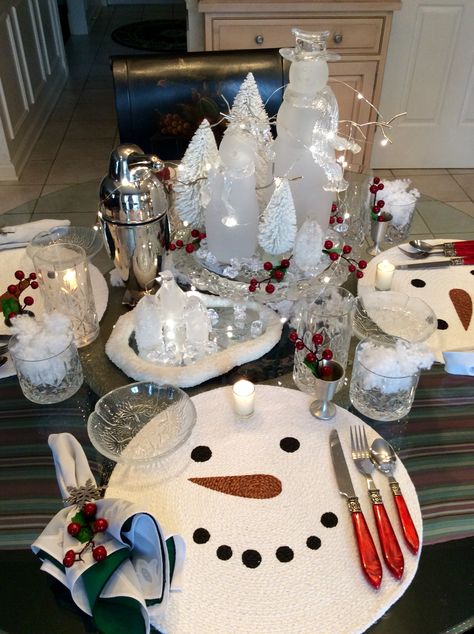 Icy winter tablescape features snowmen and penguins for some post holiday fun. Placemats from Kohls last year. Vintage looking stainless penguin shaker from Restoration Hardware. Cut crystal barware glasses are Bohemian. Winter Table Setting, Christmas Tea Party, Polar Bear Christmas, Bottle Brush Christmas Trees, Winter Table, Table Setting Inspiration, Christmas Snow, Christmas Tea, Christmas Table Settings