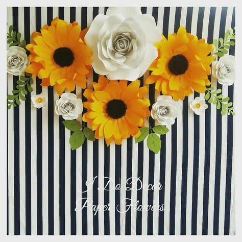 Sun flowers. Sunflower and rose paper flower backdrop. Durban paper flowers Sunflower Backdrop Ideas, Rose Paper Flower, Sunflower Party, Sunflower Baby Showers, Rose Paper, Paper Flower Wall Decor, Sun Flowers, Large Paper Flowers, Paper Black