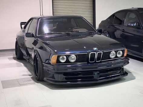 BMW 6 Series E24 Wide body Kit DTM style Read the full story dedicated to this awesome black wide body BMW 6-Series E24 on Eurolism #bmw Bmw Wide Body Kit, Bmw E30 Wide Body Kit, Bmw 635 Csi, Bmw 635, Car Builds, Bmw E24, Bmw E38, Wide Body Kits, Bmw 6 Series