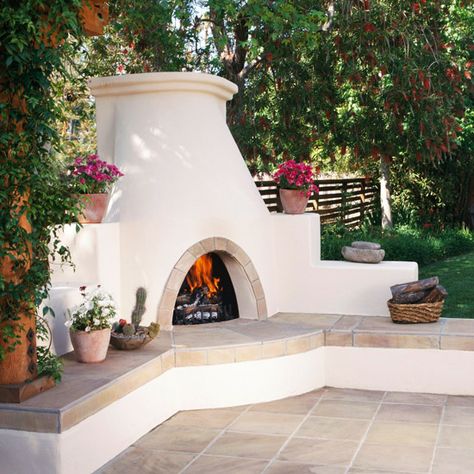 This grand fireplace has plenty of room for plants and seating! More fabulous outdoor fireplace: http://www.bhg.com/home-improvement/porch/outdoor-rooms/fabulous-outdoor-fireplaces/?socsrc=bhgpin071313whitefireplace=16 Outdoor Fireplace, Fireplace, Plants