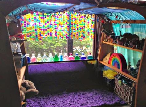 Wooden arch draped with a pretty fabric.  Translucent bingo chips attached to strings, hanging from the fabric. Adds color and wonder to the classroom environment. - B Reggio Color Display, Reggio Rainbow Ideas, Rainbow Reggio Activities, Reggio Library Area, Waldorf Curtains, Rainbow Window, Reggio Inspired Classrooms, Sensory Room, Diy Rainbow