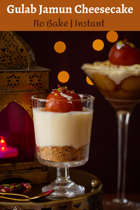 no bake gulab jamun cheesecake jar placed on a brass tray Gulab Jamun Dessert Shots, Indian Party Dessert Ideas, Indian Dessert Table Ideas, No Bake Gulab Jamun Cheesecake, Indian Dessert Ideas, Gulab Jamun Dessert Cup, Gulab Jamun Fusion Dessert, Diwali Dessert Ideas, Gulab Jamun Cheesecake