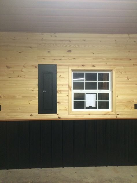 Wall of garage, tongue and groove pine, black 40yr roofing metal at bottom with copper colored j channel. Copper colored 40 year roofing metal on ceiling, breaker box painted black with truck bed liner. Tongue And Groove Basement Walls, Black Corrugated Metal Ceiling, Corrugated Metal Wall Mudroom, Galvanized Tin Walls Man Cave, Garage Interior Walls Wood Boards & Planks, Tounge And Groove, Truck Bed Liner, Building A Pole Barn, Wood Plank Walls