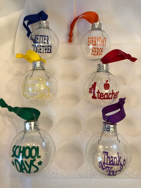 "Set of 6 teacher ornaments. These are 2\" glass ornaments filled with white glitter and tied with ribbon. Everyday Hero's, Better Together, #1 Teacher, School Days, and a Bus. Great gift for a teacher to set on her desk. Great as a teacher appreciation gift and Great way to say Thank You to your child's teacher for all they do!! Keepsake gift for any teacher to use every year. Metal stand not included but do sell ornament holder on my site." Ornament Holder, Teacher Ornaments, Teacher School, Everyday Heroes, Holiday Kitchen, Kitchen Towel Set, Teacher Appreciation Gift, Metal Stand, Wooden Ornaments