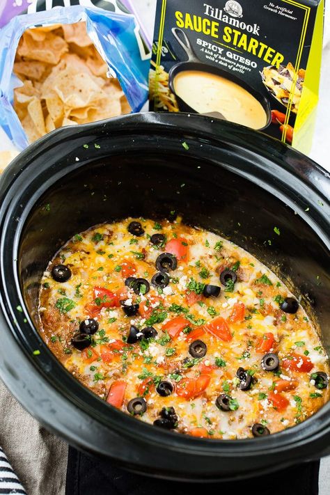 There's dip recipes and then there's this, the Most Delicious Slow Cooker Taco Dip recipe. It's a layer of spicy queso, saucy ground beef and lots of cheese. So easy in the slow cooker! #dip #appetizer #tillamook #slowcooker #tacodip #footballfood #spicyqueso #mexicanfood #cheese #groundbeef Crockpot Ground Turkey, Taco Dip Easy, Slow Cooker Taco, Spicy Queso, Slow Cooker Ground Beef, Taco Dip Recipe, Layered Taco Dip, Beef Dip, Ground Turkey Tacos