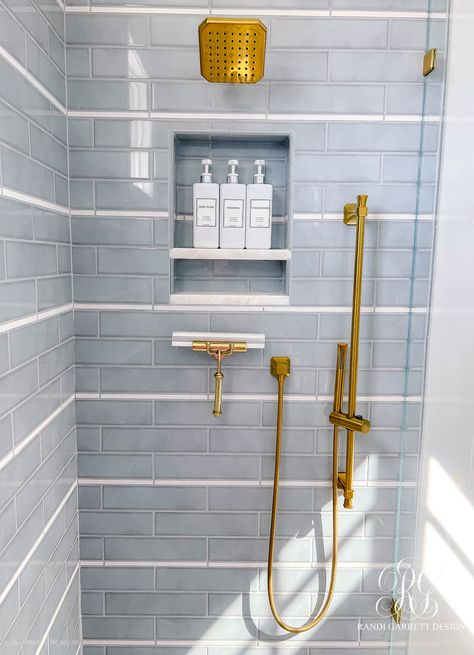 Bath Tile Inspiration, Nautical Shower Tile Ideas, Pool Bath Shower Tile, Aqua Penny Tile, Guest Bathroom Tile Shower Ideas, White Subway Tile With Accent Strip, Using Kitchen Cabinets In Bathroom, Navy Blue Accent Tile Shower Wall, Primary Bath Tile Ideas