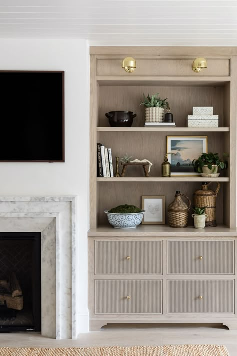 Lovely custom built in shelves and storage in a living room space Built Ins With Drawers, Living Room Television Wall Ideas, Custom Cabinets Living Room, Family Room Fireplace Ideas, Modern Traditional Fireplace, Mindy Gayer Design, Modern Traditional Home, Cosy Fireplace, Tv Built In