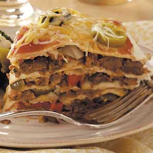 Vegetarian Tortilla Stack Recipe -“Nearly all the meals I make are meatless," writes Wendy Fenstermacher of Allentown, Pennsylvania. "This is one of my husband’s favorites. If you like, you could vary the amount of jalapeno slices—or leave them out altogether. But I wouldn’t!” — Tortilla Stack, Mexican Lasagna Recipes, Mexican Tortilla, Sauteed Peppers And Onions, Enchilada Bake, Fresh Fruit Recipes, Mexican Casserole, Country Magazine, Lasagna Recipe