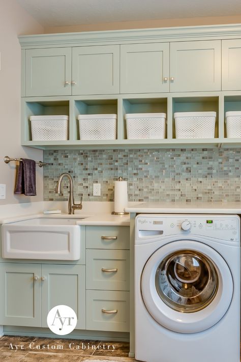 This adorable pastel laundry room provides an elevated esthetic to the cleanest room of the home. 💚 Pastel Laundry Room, Custom Laundry Room Cabinets, Custom Laundry Room, Above The Sink, Laundry Room Cabinets, Desk Areas, Cute Pastel, Doing Laundry, Laundry Room Organization