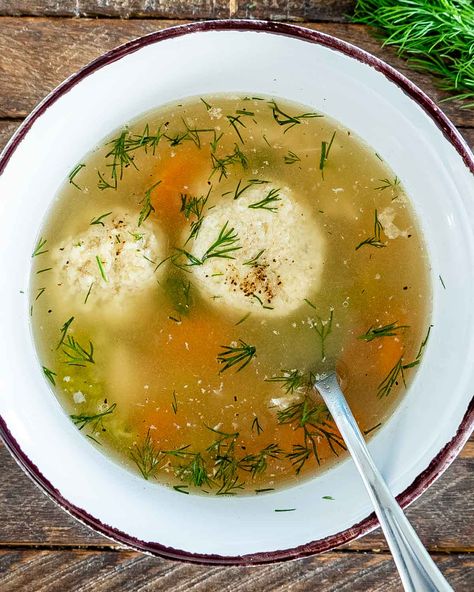 This Matzo Ball Soup is an exceptionally delicious Jewish dish made with matzah meal dumplings. One sip and and you will be hooked! #matzo #matzoballs #soup #recipe Chicken Matzo Ball Soup Recipe, Matzah Ball Soup Recipe, Matzo Ball Recipe, Matzo Ball Soup Recipe, Matzah Ball Soup, Kid Friendly Meals Dinner, Matzah Ball, Matzo Ball, Matzo Ball Soup