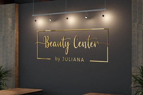 The laser-cut details create a mesmerizing display that instantly catches the eye. The combination of metal and acrylic adds depth and dimension to the design, making it a standout piece of rust   #customsigns #3dsigns #homedecor #businesssignage #officedesign #storefront #logodesign #emblem #acrylicart #metalsigns #woodworking #interiorinspiration #colorfulcreations #artisticcraftsmanship #uniquedesigns #lightedsigns #personalizedart #customlasercut#goldmirror#silvermirror#rosegoldmirror Salons With Plants, Accent Wall Business, Salon Statement Wall, Black And Gold Spa Room, Esthetician Wall Decor, Neutral Salon Aesthetic, Salon Spa Ideas Interior Design, Black And Gold Esthetician Room, Salon Accent Wall