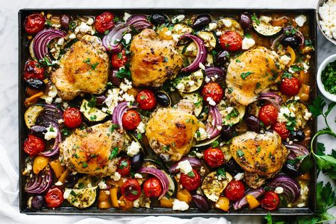 Greek Sheet Pan Chicken Dinner - Downshiftology Greek Sheet Pan Chicken, Greek Sheet Pan, Greek Dinner, Crispy Baked Chicken Thighs, Sheet Pan Meals Chicken, Chicken Tray Bake, Greek Dinners, Sheet Pan Chicken, Greek Lemon Chicken