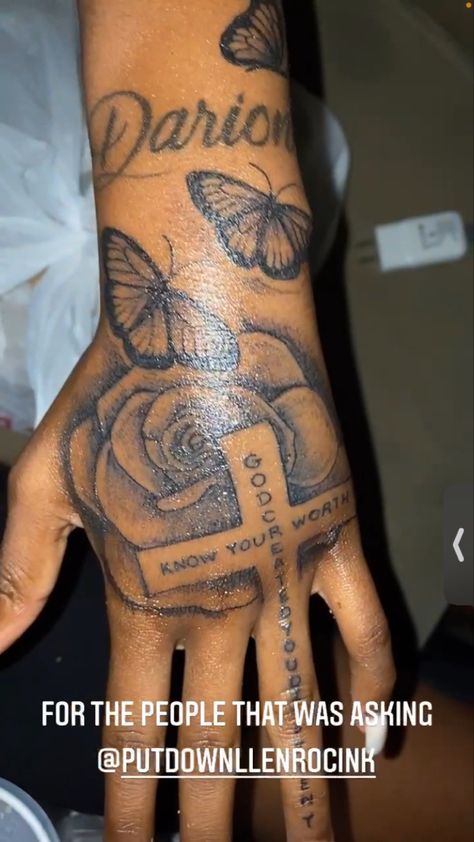 Rose And Cross Hand Tattoo, God Created You Different Tattoo Hand, Baddie Rose Tattoo, Black Love Tattoos, Butterflie Tattoo On Hand, Baddie Hand Tattoos, Dope Hand Tattoos For Women, Boyfriend Name Tattoos For Women, Cross Tattoo On Hand