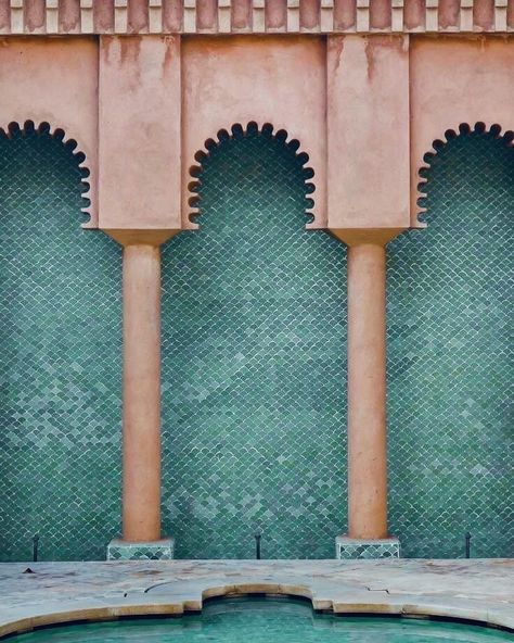 The elegant arches and slender columns create a sense of symmetry and openness, while the intricate green zellige tiles add texture and depth. The warm terracotta tones of the arches blend perfectly with the cool greens of the tiles and the reflective pool below, creating a serene, balanced atmosphere. This mix of form, color, and nature is a timeless example of Moroccan craftsmanship and a stunning tribute to the harmony of Moorish design. Photographer unknown #hotel #moorish #tiles #hist... Moorish Design, Interior Design Courses, Moroccan Tiles, Zellige Tile, Interior Design, Green, Design