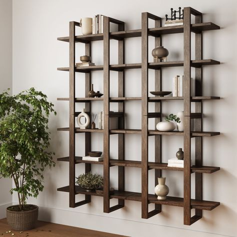 Width: 28 inches Height: 31.9 inches Length: 10.2 inches Meet Benji, our modern modular bookcase that’s sure to make a statement. Its three solid wood shelves and adjustable vertical arms (move them apart, or keep them close together) in a wire brushed dark brown finish give Benji a modern style with an open and airy feel. Get creative and hang multiple bookcases vertically or horizontally to build the statement bookcase wall of your dreams. There’s room for things of every shape and size on our Wood Wall Shelves, Modular Bookcase, Tiered Display Shelves, Nathan James, Indoor Plant Wall, Modern Wall Shelf, Bookcase Wall, Solid Wood Shelves, Wall Bookshelves