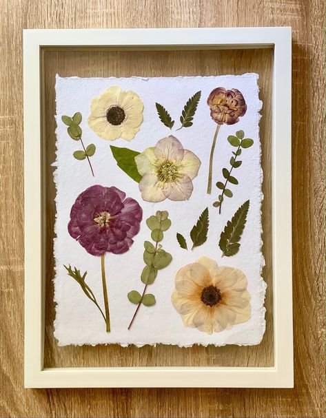 "A beautiful spring bouquet preserved to enjoy for years to come. Locally grown flowers include ranunculus, hellebore, and anemone. The greens are ferns, and eucalyptus. Each flower and greenery has been hand pressed by me.  This piece is available to purchase with or without the frame, as shown in the picture. Without the frame, the piece measures 9\"x12\". With frame, it measures 12\"x16\"." Pressed Eucalyptus Frame, Flower Preservation Frame, Pressed Eucalyptus, Pressed Flower Bouquet, Bouquet Ranunculus, Pressed Florals, Flower Frames, Flower Picture Frames, Wedding Bouquet Preservation