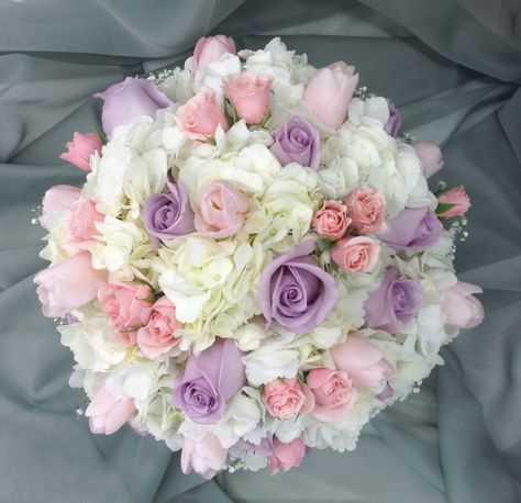 Pink, lavender and white bridal bouquet with hydrangea, tulips, roses and spray roses by Nancy at Belton Hyvee. Quince Tulip Bouquet, Pink Purple And White Flowers, Pink And Purple Roses Bouquet, Pink Purple And White Bouquet, Pink And Purple Roses, Light Pink Bouquet, Cherry Blossom Bouquet, Pink Tulips Bouquet, White Rose Centerpieces