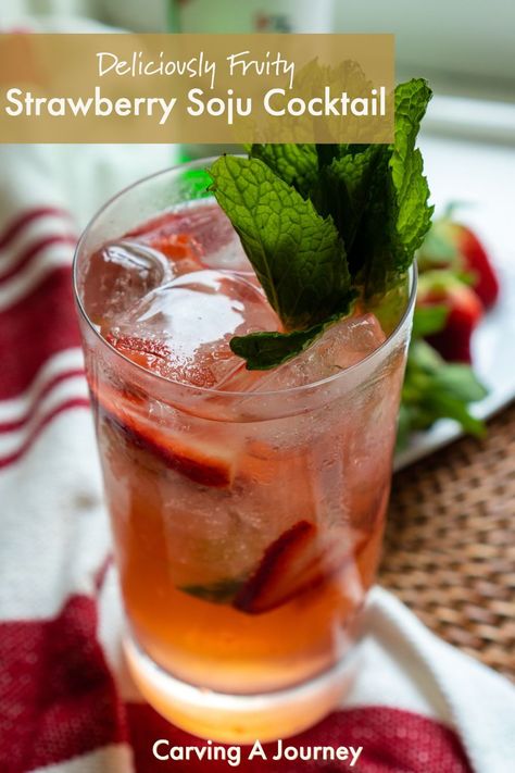 A side shot of a highball glass filled with orangey-red liquid. This liquid is a strawberry soju cocktail. In the cocktail there is ice, fresh strawberries, and lime wedges. A mint sprig sits at the top of the glass as a garnish. The glass sits on a red and white towel on a placemat. A green bottle of soju sits in the background next to a plate of whole, fresh strawberries. The image is on a window sill. Strawberry Soju Cocktail Recipes, Soju Cocktail Recipes, Summer Party Punch, Strawberry Soju, Soju Cocktail, Korean Strawberry, Room Surprise, Cocktail Inspiration, Korean Drinks