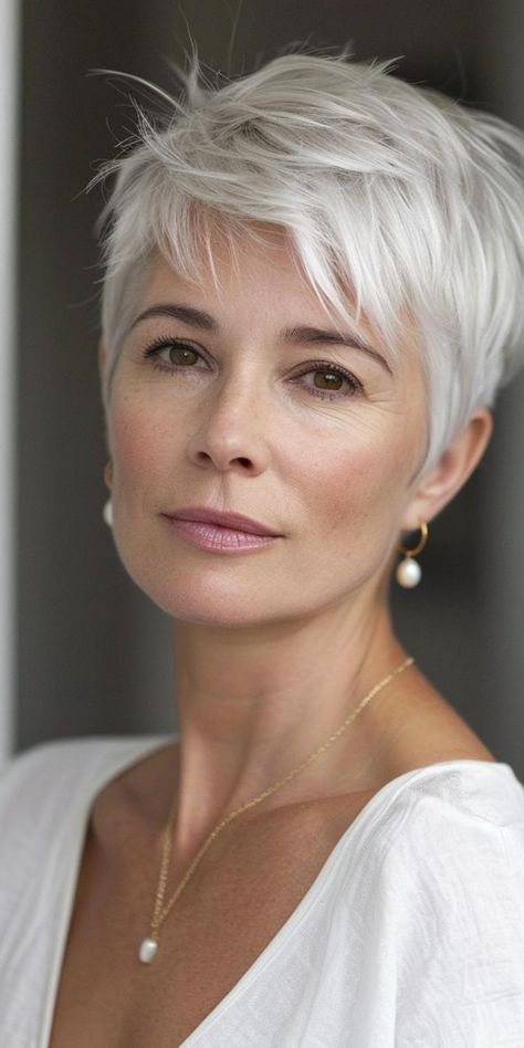 Discover 30 flattering short haircuts that celebrate the grace of women over 50. These stylish looks prove that short hair can be versatile, sophisticated, and youthful. From feathered crops to asymmetrical bobs, find the perfect style to complement your lifestyle and personality. Embrace your age with confidence through these modern and low-maintenance short hairstyles. Kristin Scott Thomas Short Hair, Pixie Haircut Low Maintenance, Short Pixie Cuts For Women Over 60, Best Pixie Cuts For Fine Hair, Women’s Short Haircuts Pixie, Cropped Haircut For Women, Short Hair For Women Over 50, Short Blonde Hair Pixie, Very Short Hairstyle Women