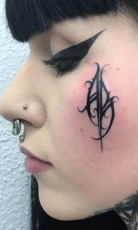 Tattoo On Face Women, Goth Face Tattoo, Gothic Face Tattoo, Dark Face Tattoo, Goth Lettering Tattoo, Face Tattoo Women, Tattoo Ideas Face, Cute Face Tattoos, Small Face Tattoo