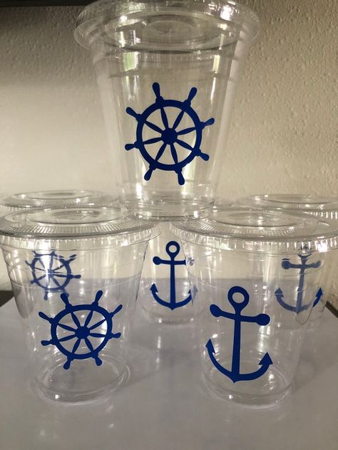 12oz clear plastic disposable cups affixed with assorted  blue anchors and ships wheels vinyl decals , plastic lid and strawEach set includes a equal amount of cups, lids and blue and white paper straws Available in assorted quantities Shipping is for First Class Mail 3-5 business days. If you need your item sooner please upgrade to Priority Mail shipping at checkout. Sailboat Party Decorations, Yacht Party Decorations, Boat Theme Party, Sailor Theme Party, Boat Party Theme, Sailboat Party, Ocean Theme Party Decorations, Sailing Party, Iron Man Party