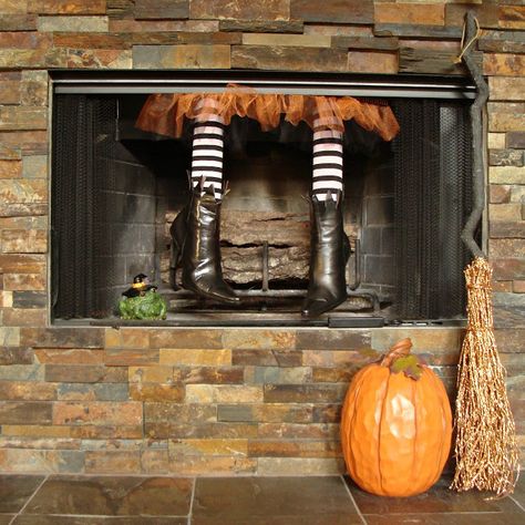 Though not technically a mantel, we had to include this cute DIY fireplace craft. Mother and daughter bloggers Jeanette and Leigh of Crafty in Crosby created this pair of witch legs out of old boots, a pool noodle, and Halloween tights. Unique Fireplace, Halloween Mantel Decor, Halloween Tights, Halloween Fireplace, Halloween Decor Diy, Mantel Decorating, Hallowen Ideas, Casa Halloween, Halloween Mantel