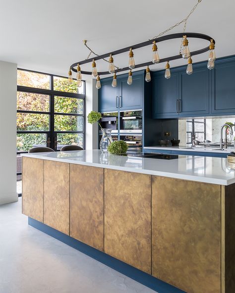 This kitchen combines classic shaker-style cabinets with a contemporary antique brass island, all wrapped in a stunning ultramarine blue theme, creating a perfect blend of tradition and modernity. #KitchenDesign #ShakerStyle #KitchenGoals https://www.solakitchens.com/ultramarine-and-brass/ Brass Island, Hanging Light Bulbs, Shaker Style Cabinets, Ultramarine Blue, Room Black, Blue Theme, Kitchen Plans, Blue Kitchens, Utility Room