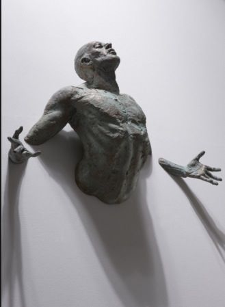 This shows a man who is trapped or stuck in a wall and looks like he wants to get out. معرض فني, Andermatt, Wow Art, Sculpture Installation, Figurative Sculpture, 3d Wall, Bronze Sculpture, Art Sculpture, Art Plastique