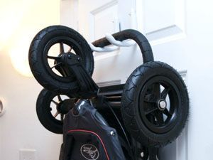 Stroller Storage In House, How To Store Strollers In Garage, Stroller Trunk Hack, Stroller Storage Ideas, Garage Stroller Storage, Stroller Storage Apartment, Bob Stroller Storage Garage, Stroller Storage Garage, Entry Closet Makeover