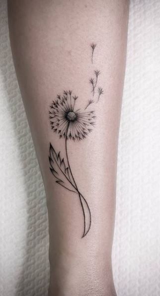 Tattoos For Wanderers, Dandelion And Four Leaf Clover Tattoo, Most Popular Womens Tattoos, Small Tattoos Dandelion Ideas, Ankle Tattoo Dandelion, Tattoo Designs Dandelion, Collarbone Dandelion Tattoo, Dandy Lion Tattoos Dandelion Art, Dandelion Tattoo With Initials