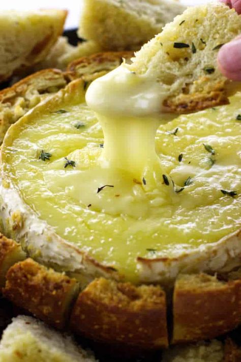 This baked Brie in a bread bowl is an easy appetizer. Garlic butter, sourdough bread, Brie and fresh thyme all baked to a gooey goodness. The bread bowl is a pull-apart for dippers. #appetizer #partyfood #bakedcheese Garlic Butter Baked Brie In A Bread Bowl, Bread Brie Bowl, Sourdough Bread Appetizers, Brie Baked In Bread, Bread Bowl Brie, Brie In Sourdough Bowl, Brie In A Bread Bowl, Brie Bread Bowl Baked, Brie Bowl Bread