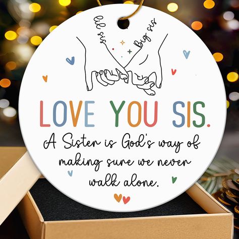 PRICES MAY VARY. SISTER GIFTS FOR SISTER: Gift this ceramic ornament with the heartfelt message "Sister Is A God's Way Of Making Sure We Never Walk Alone" to celebrate the enduring and unbreakable bond you share with your sister, even when you're miles apart. Suitable for Unique Sister Ornaments, Sister Ornament, Funny Sister Ornament SISTER ORNAMENT 2024: Gifting this ornament inspires you both to create more meaningful and cherished memories together, whether you're near or far. It becomes a s Birthday Gifts For Big Sister, Sister Ornaments, Lil Sis Big Sis, Sister Ornament, Gifts For Sisters, Love You Sis, Funny Sister, Ornament Hanger, Big Sister Gifts