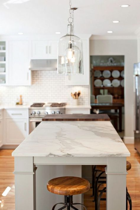 A nice island can create the ideal look (and versatility) for your kitchen. This one combines the calacatta with butcher's block to create a more useful accent. Small Farmhouse Kitchen, Kitchen Traditional, Island Countertops, Farmhouse Kitchen Design, Kitchen Farmhouse, Kitchen Design Decor, Kitchen Marble, Modern Farmhouse Kitchens, Kitchen Paint