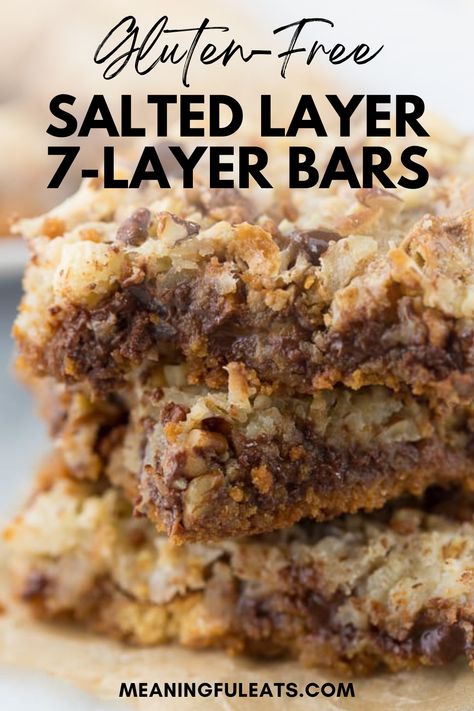 Three 7 layers bars stacked on top of each other made with toasted coconut, pecans, chocolate chips Gluten Free Seven Layer Bars, Gluten Free Squares And Bars Recipes, Gluten Free 7 Layer Bars, 7 Layer Cookies, Meaningful Eats, Seven Layer Bars, 7 Layer Bars, Gluten Free Graham Crackers, Best Gluten Free Desserts