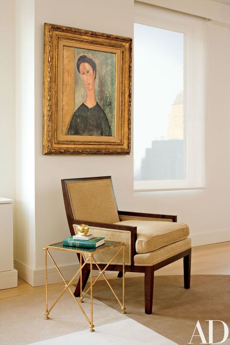 A Modigliani portrait hangs above an armchair, from Holly Hunt, and a side table, from Maison Gerard | archdigest.com Modigliani Portraits, New York Penthouse, Apartment Needs, Art Placement, Classic Paintings, Traditional Living Room, The Grove, Architectural Digest, Beautiful Interiors