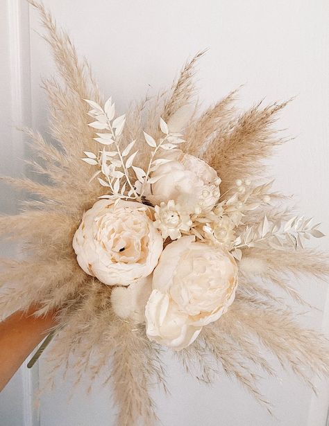 Dried flower bouquet Blush bridal bouquet Boho wedding MEASUREMENTS: M size Total height : 35 -40 cm (13,7 - 15,7 Inches) Total width: 20 -23 cm (7,8 - 9 Inches) Set of the accessories: https://www.etsy.com/listing/946119803/blush-flower-hair-pin-accessories-dried?ref=shop_home_active_17&pro=1&frs=1 The price includes a bouquet only. Vases and other decor are not included. 🔘 SHIPPING INFO! The item will be shipped in 3-5 days after purchase. It takes about 10-21 days to reach the destin White Dried Flower Bouquet, Peony Roses, Blush Bridal Bouquet, Flower Peony, Peony Bouquet Wedding, Boho Wedding Bouquet, Boho Wedding Flowers, Boho Bouquet, Peony Wedding