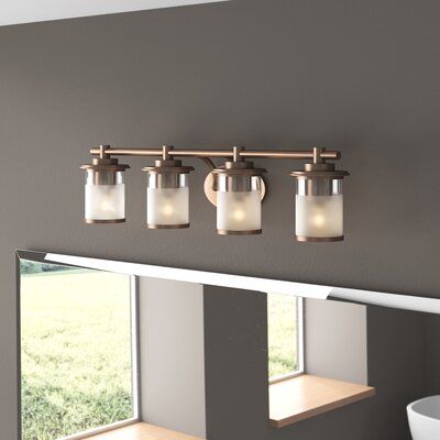 If your powder room needs a pick-me-up, This 4-light vanity light brings both styles and shine to your spa-worthy space. It's crafted from metal with a sleek chrome or gold finish, and its frame features an oval backplate and a tubular bar that extends just over 32" long. The bar sits four lights, each highlighted by a cylindrical metal and glass shade that can be installed facing up or down. Inside each shade, it houses one medium-base bulb up to 100W. | Zipcode Design™ Davis 4-Light Vanity Lig Light Vanity, Gold Chrome, Vanity Light, Satin Brass, Yellow And Brown, Vanity Lighting, The Bar, Powder Room, Lighting Fixtures