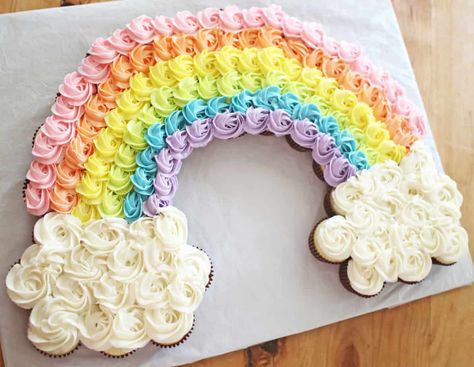 This Rainbow Cupcake Cake (also called a Pull-Apart Cake) is pretty and perfect for any rainbow-themed birthday party. It's easy to put together but looks so impressive and will feed a crowd! Use any flavor cake that you like to make this fun birthday cake! #rainbow #cupcakecake #pullapartcake Cake Out Of Cupcakes, Rainbow Cupcake Cake, Birthday Cake Rainbow, Blippi Party, Cupcake Template, Rainbow Themed Birthday Party, Cake Rainbow, Rainbow Cupcake, Pull Apart Cupcake Cake