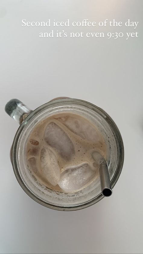 Iced coffee in a glass mug with a metal straw on a white table, text over top saying “second iced coffee of the day and it’s not even 9:30” Coffee In The Morning, Aesthetic Coffee, Glass Mug, Cocktail Strainer, Metal Straws, White Table, In The Morning, Iced Coffee, The Morning