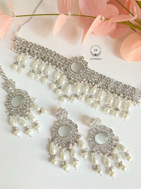 Just read the book to know.

This book is inspired by the book Enigma… #fantasy #Fantasy #amreading #books #wattpad Jewellery For White Lehenga, White Necklace Set, Earrings For White Dress, White Jewellery Set, Punjabi Jewellery, Unique Pearl Necklace, Onam Outfits, Choker Sets, Punjabi Jewelry