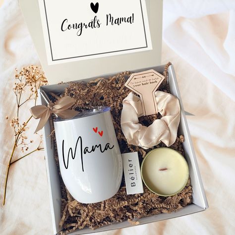 "Our new mom gift basket is the perfect way to celebrate and honor the incredible journey of motherhood.  ♡Designed to bring comfort and joy to the new mom this gift box includes a personalized mama tumbler,  a soothing scented candle for moments of relaxation, and a silk scrunchie. Whether it's a baby shower or simply wanting to show your support, this gift box is sure to bring a radiant smile to any mom's face. ♡ MOM GIFT BASKET INCLUDES: * 12oz. Personalized Mama Tumbler. * 4oz Gold Tin Soy C Mothers Day Gift Basket, New Mom Gift Basket, Bride Tumbler, Engagement Gift Boxes, Mom Gift Basket, Cozy Morning, Gifts For Expecting Parents, Preschool Gifts, Expecting Mom Gifts