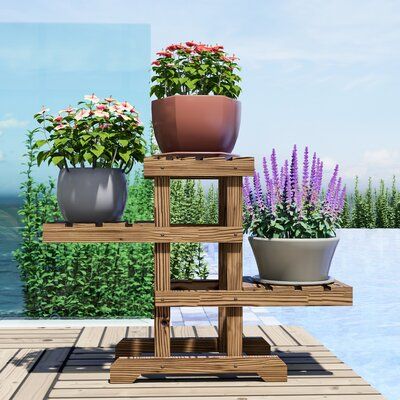 It is made of solid fir wood. It is a simple and practical design. You can display a wooden flower pot shelf, potted plants, pottery or other decorative items. This plant stand makes it possible to decorate with plants everywhere at your home. Perfect for your patio, or in the backyard, or garden to enhance the house decor. | Bay Isle Home™ Eisele Zigzag Pallet Plant Stand Wood in Brown | 19.69 H x 27.95 W x 9.45 D in | Wayfair Pallet Plant Stand, Plants Everywhere, Decorate With Plants, Lawn Care Business Cards, Outdoor Shelves, Support Pour Plante, Wood Pots, Plant Stands Outdoor, Wooden Plant Stands