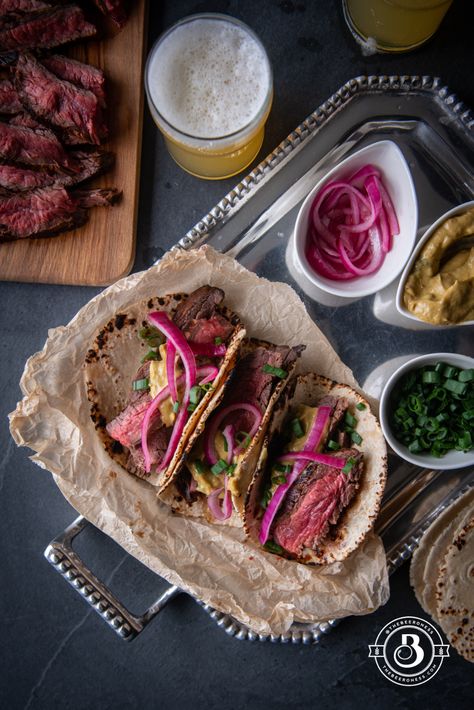 Michelada Marinated Steak Tacos with Chipotle Avocado Sauce and Beer Pickled Onions - The Beeroness Dessert Taco, Cooking With Beer, Steak Tacos, Avocado Cream, Avocado Sauce, Michelada, Marinated Steak, Homemade Tortillas, Braised Beef