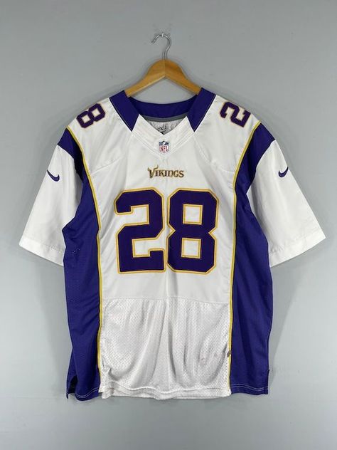 Get your hands on this vintage Minnesota Vikings NFL fan apparel featuring an Adrian Peterson jersey. Show your support for the American football team... Rugby T Shirts Design, Cool Jersey Design Football, Vintage Nfl Shirts, Vintage Football Jersey Outfit, American Football Jersey Design, Nfl Jersey Outfit, Football Jersey Design, American Football Shirt, Adrian Peterson