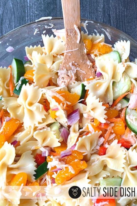 Mandarin Chicken Pasta Salad with mandarin oranges and bow tie pasta, an Asian influenced side salad great for a summer potluck #sidedish #salad Mandarin Chicken Pasta Salad, Asian Pasta Salad Recipes, Potluck Pasta Salad, Salad With Mandarin Oranges, Asian Pasta Salad, Bow Tie Pasta Salad, Asian Pasta Salads, Mandarin Chicken, Asian Pasta